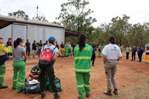 AUSTREX participants standing around a circle outside