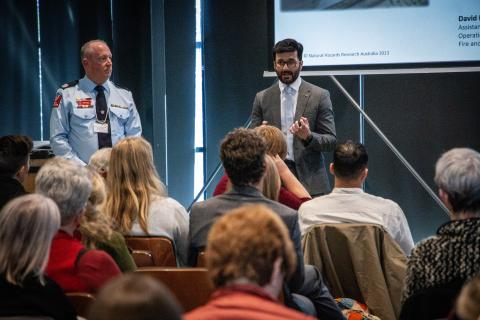 David Lewis and Adeel presenting on stage