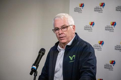 Ian Mcleod speaking at lecturn